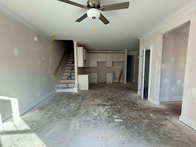 unfurnished living room with ceiling fan and crown molding