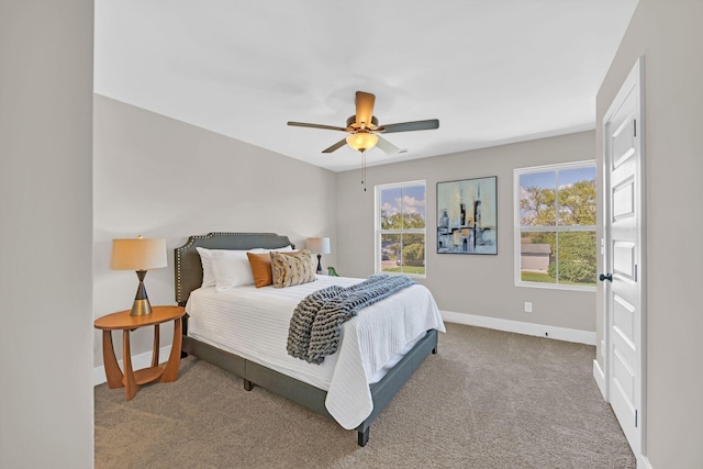 bedroom with ceiling fan and carpet flooring