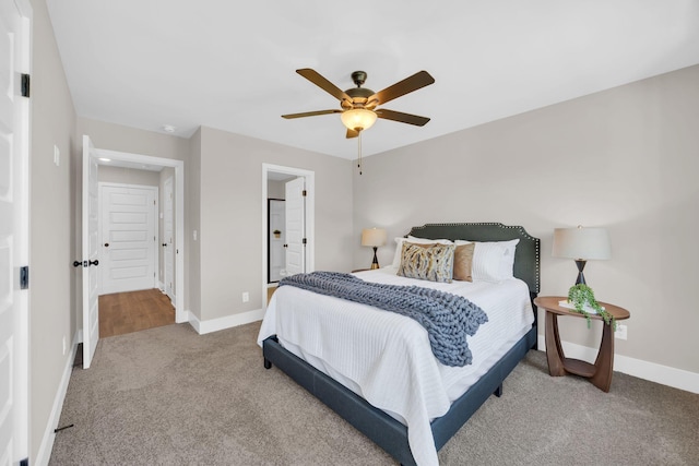 bedroom with ceiling fan and light colored carpet