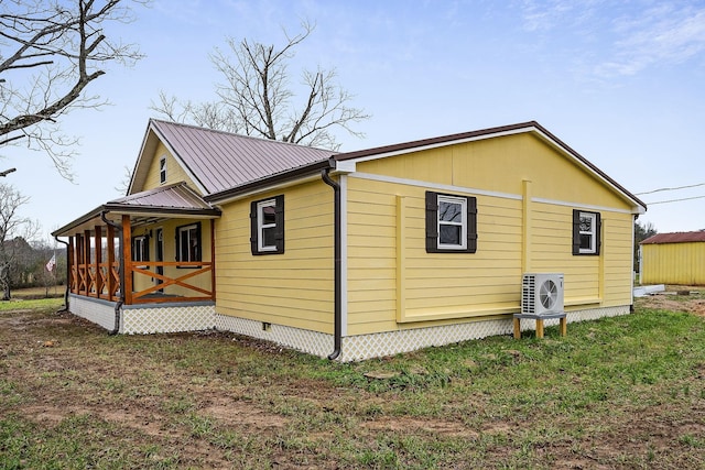 view of property exterior featuring ac unit and covered porch