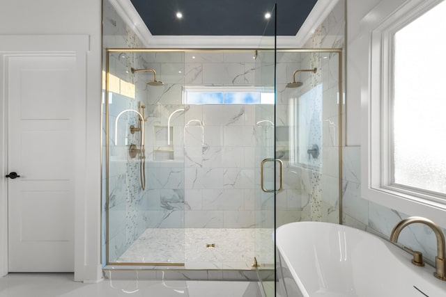 bathroom featuring shower with separate bathtub and ornamental molding