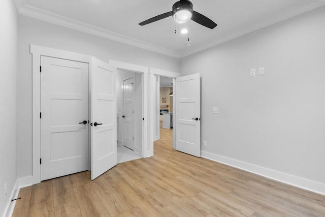 unfurnished bedroom with a closet, ceiling fan, crown molding, and light hardwood / wood-style floors