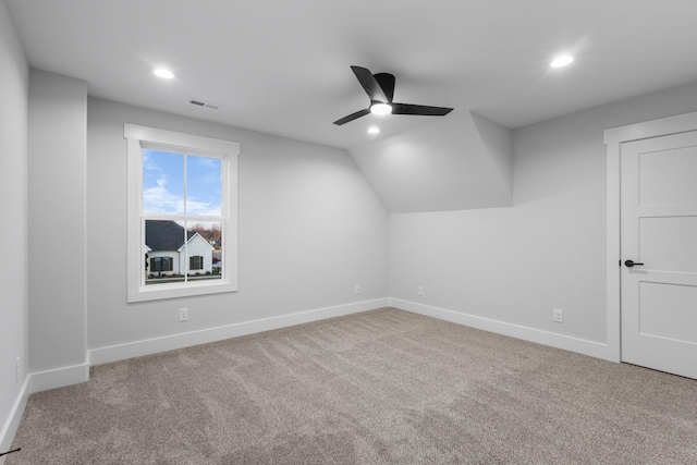 additional living space featuring ceiling fan, vaulted ceiling, and carpet floors