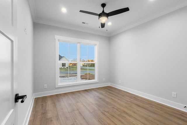 unfurnished room featuring ceiling fan, crown molding, and light hardwood / wood-style flooring