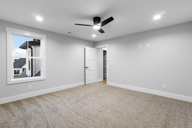 unfurnished bedroom with ceiling fan and carpet floors