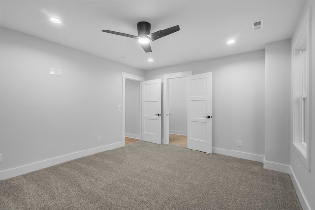 unfurnished bedroom with carpet flooring and ceiling fan