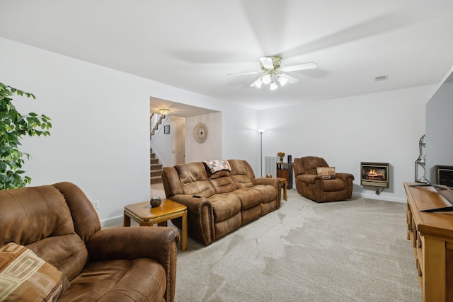 living room with light colored carpet and ceiling fan