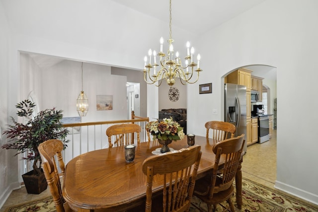 tiled dining room featuring a notable chandelier