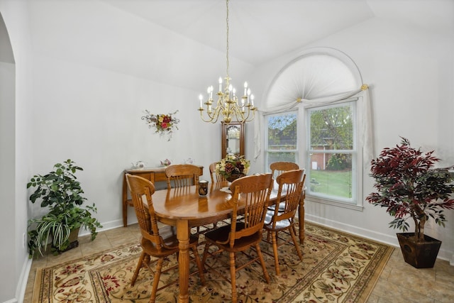 dining space with vaulted ceiling, a wealth of natural light, and a chandelier