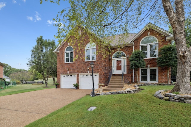 split foyer home featuring a front yard and a garage