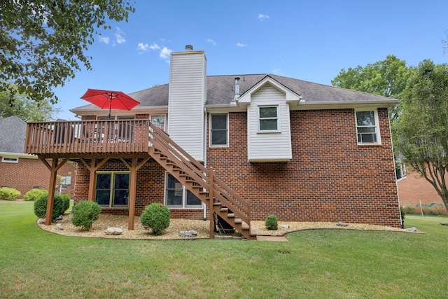 back of house featuring a deck and a lawn