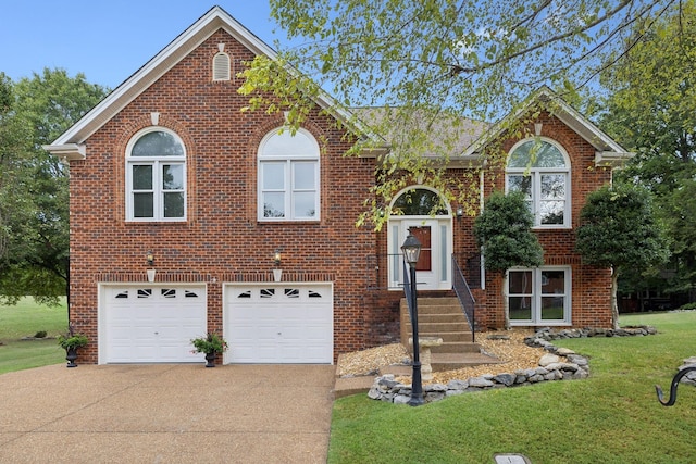 split foyer home with a front yard and a garage