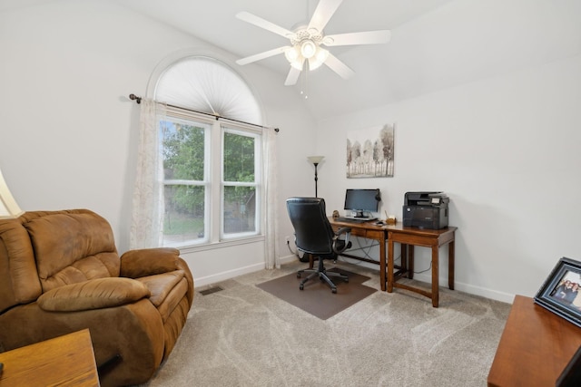 carpeted office space with ceiling fan and vaulted ceiling