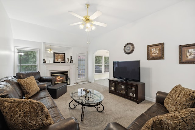 living room with lofted ceiling, light carpet, and ceiling fan