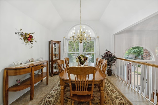 tiled dining area featuring lofted ceiling and a notable chandelier