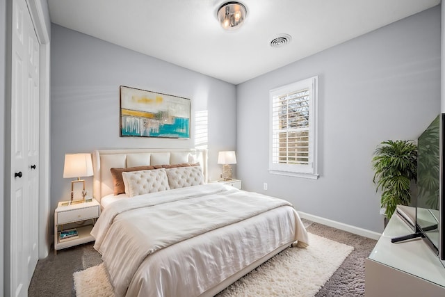 carpeted bedroom featuring a closet