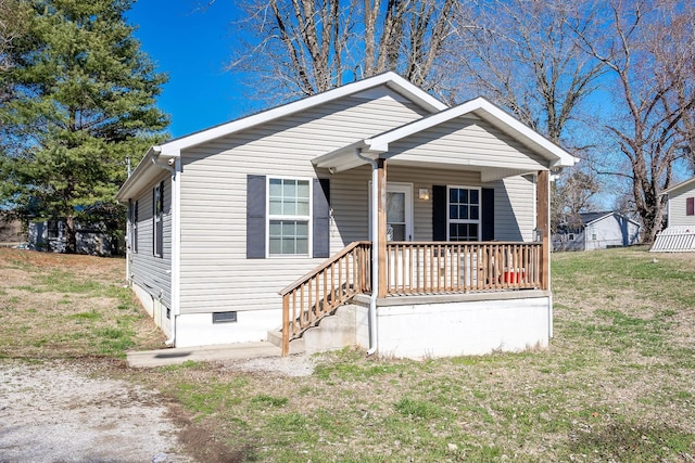 bungalow-style home with covered porch and a front lawn