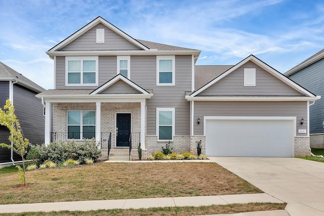 craftsman-style home featuring a front lawn and a garage