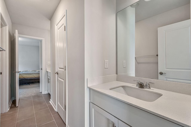 bathroom with tile patterned floors and vanity