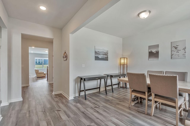 dining space featuring light hardwood / wood-style floors