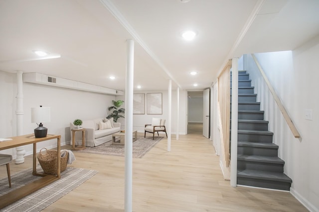 interior space with wood-type flooring and ornamental molding