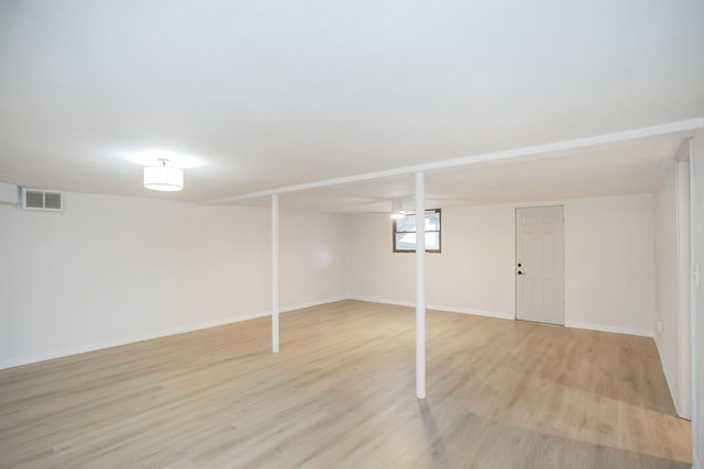 basement featuring light hardwood / wood-style floors