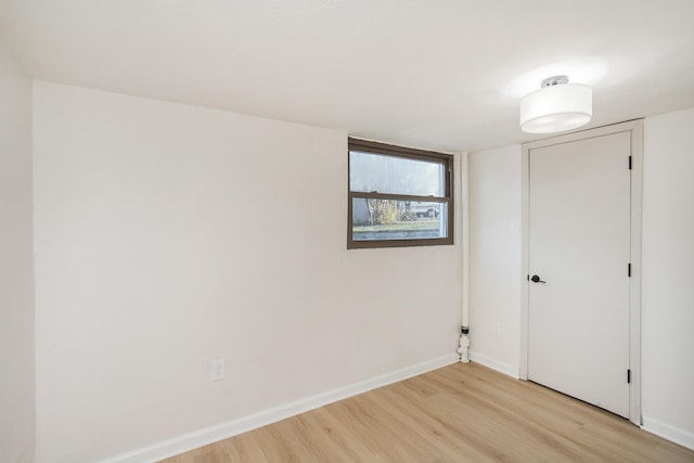 spare room featuring light hardwood / wood-style floors