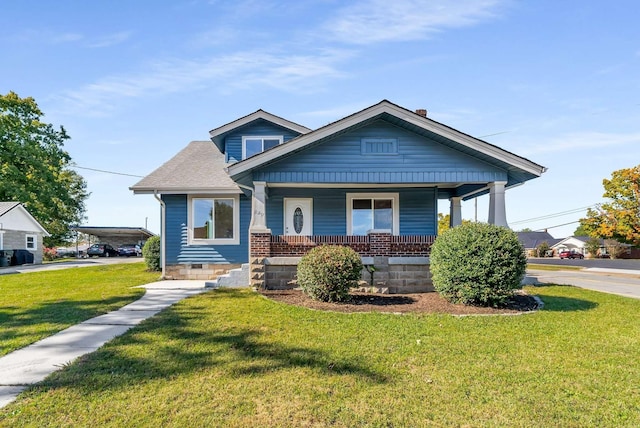 bungalow-style home featuring a front yard and covered porch