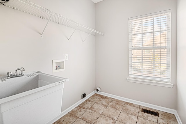 laundry room with hookup for a washing machine and sink