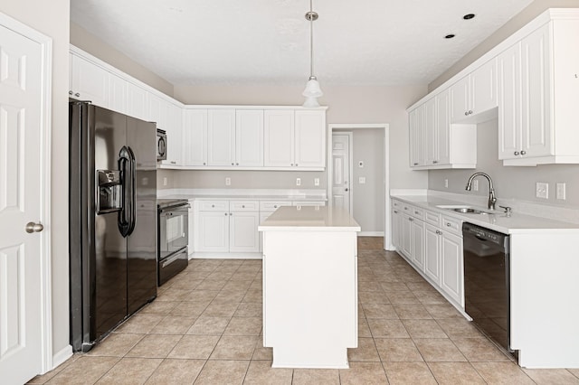 kitchen featuring sink, white cabinets, pendant lighting, a kitchen island, and black appliances