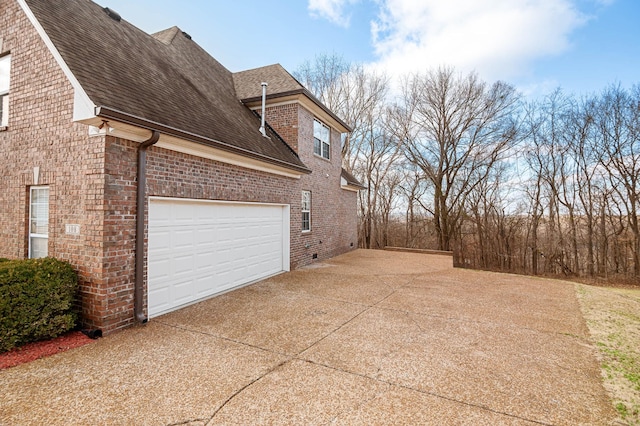 view of side of property featuring a garage