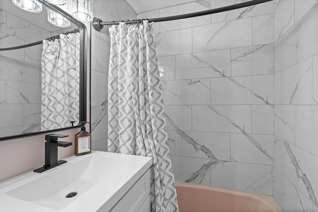 bathroom featuring shower / bathtub combination with curtain and vanity