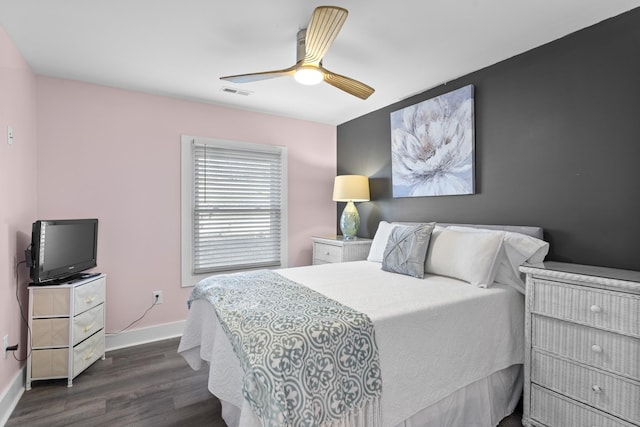 bedroom with ceiling fan and dark wood-type flooring