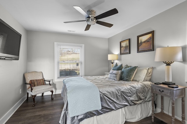 bedroom featuring dark hardwood / wood-style flooring and ceiling fan