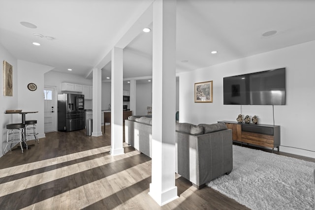 living room with dark hardwood / wood-style floors