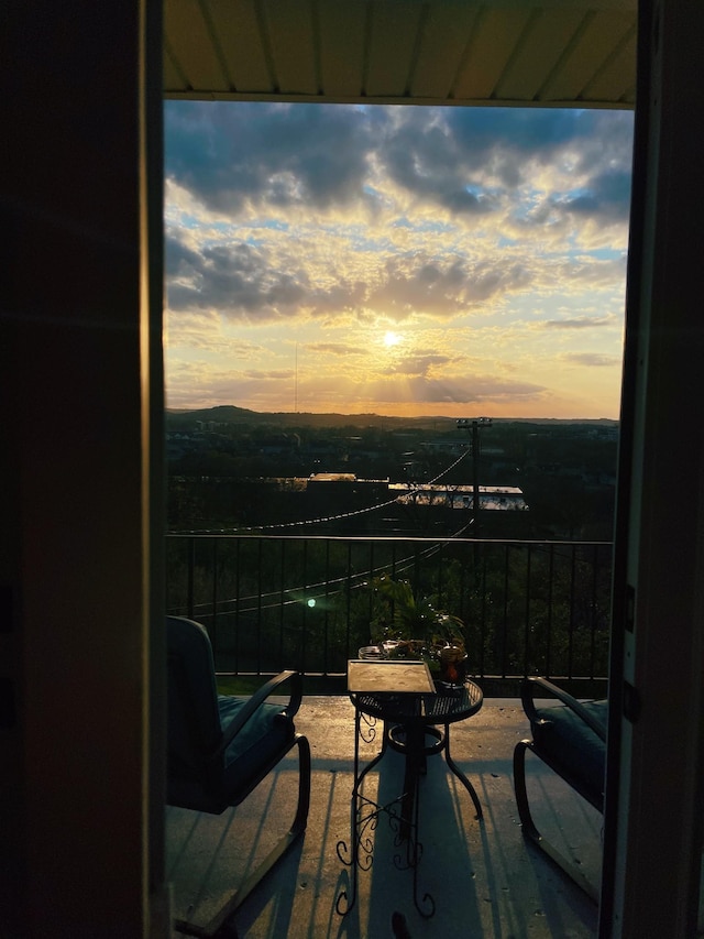 view of balcony at dusk