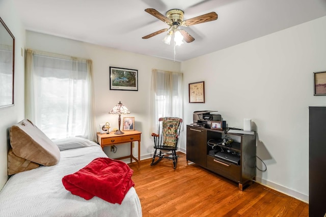 bedroom featuring ceiling fan and wood-type flooring