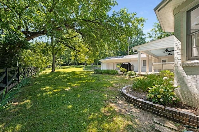 view of yard featuring ceiling fan