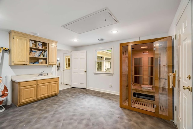 kitchen featuring sink and light brown cabinetry