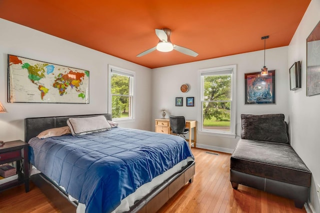 bedroom featuring ceiling fan and light wood-type flooring