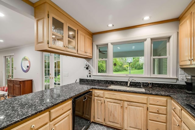 kitchen with sink, black dishwasher, dark stone counters, and light brown cabinets