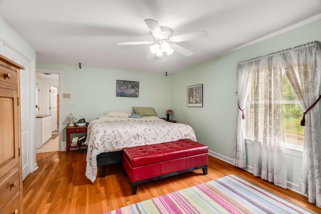 bedroom featuring hardwood / wood-style flooring and ceiling fan