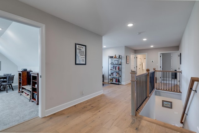 hallway with light hardwood / wood-style flooring