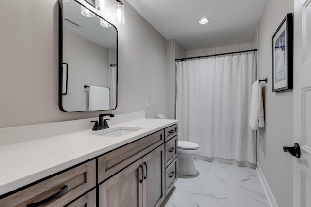 bathroom with toilet, walk in shower, and vanity