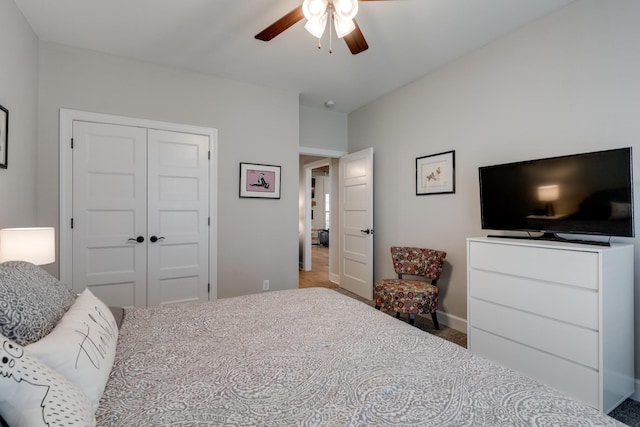 bedroom with ceiling fan and a closet