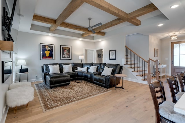 living room featuring ceiling fan, beam ceiling, and coffered ceiling