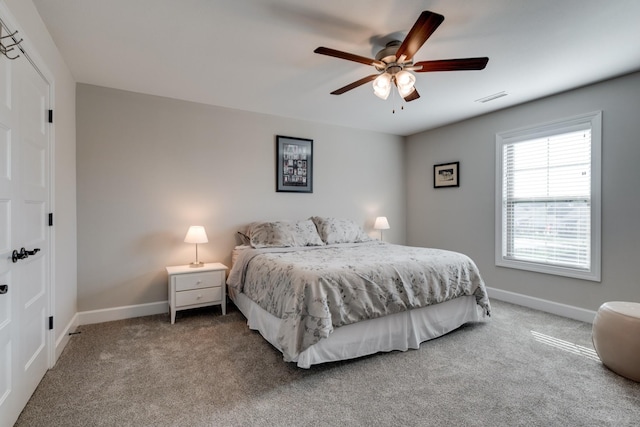 carpeted bedroom with ceiling fan