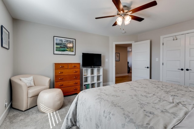 bedroom with ceiling fan, a closet, and carpet