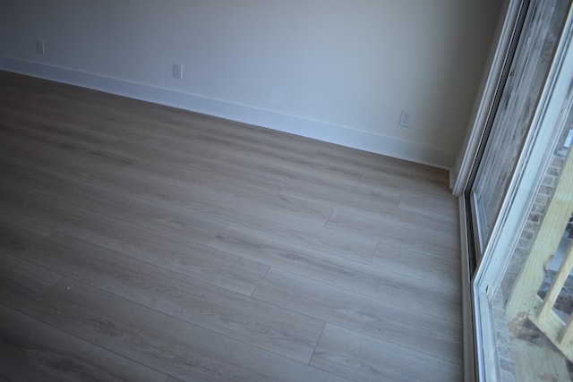 unfurnished room featuring light hardwood / wood-style flooring