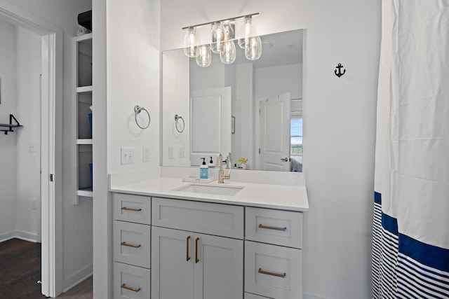 bathroom featuring hardwood / wood-style floors and vanity